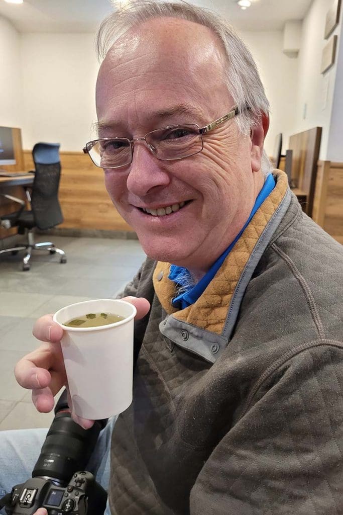 About Me - Neil drinking Coca tea to combat altitude sickness in Cusco, Peru