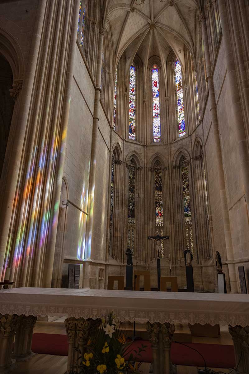 Light from stained glass windows reflected in the stonework at Bathala Cathedral