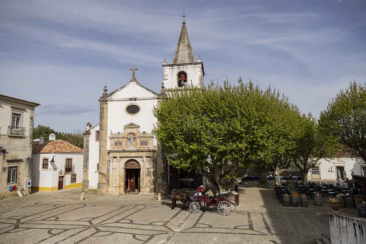 Tiled square with old church and horse and card - Obidos
