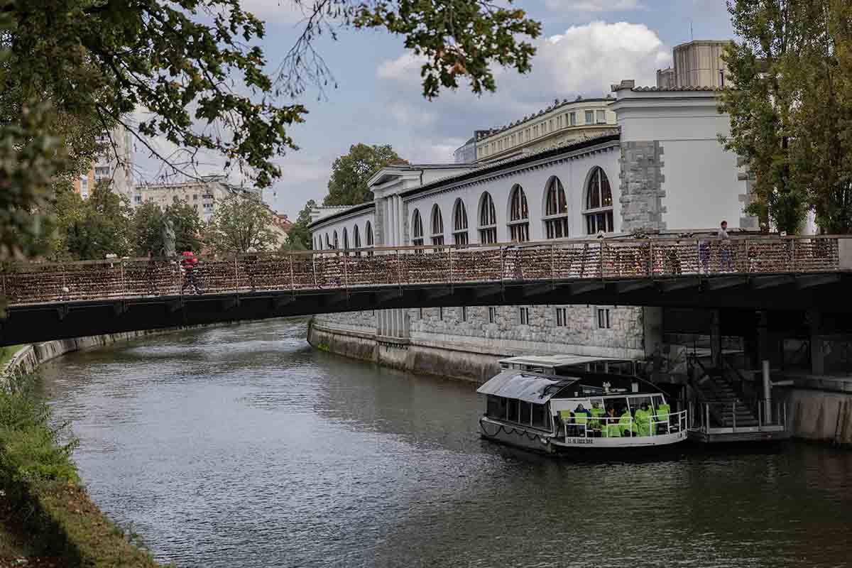 River cruise boat under the Butcher's Bridge in Ljubljana
